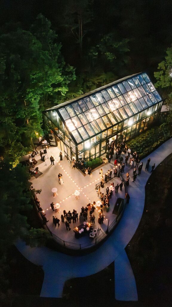Greenhouse wedding venue at night.