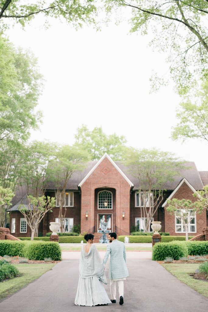 Bride and groom walking toward Britton Manor