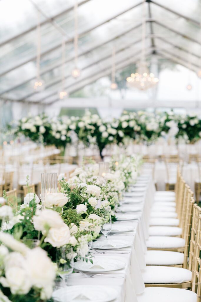 Green and white florals under cleartop tent