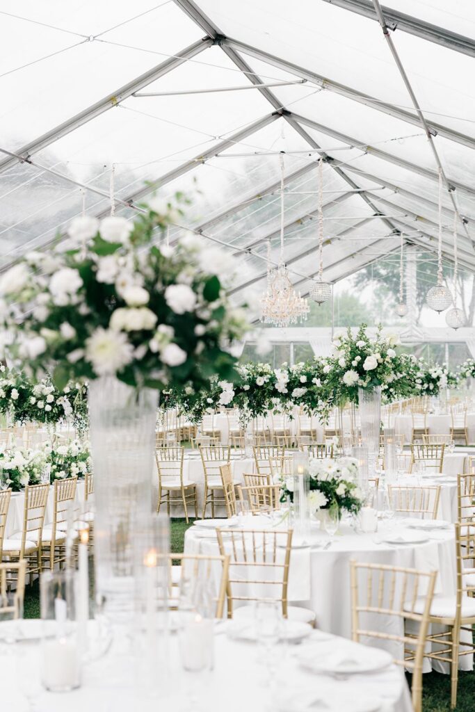 Gold and white wedding under clear tent