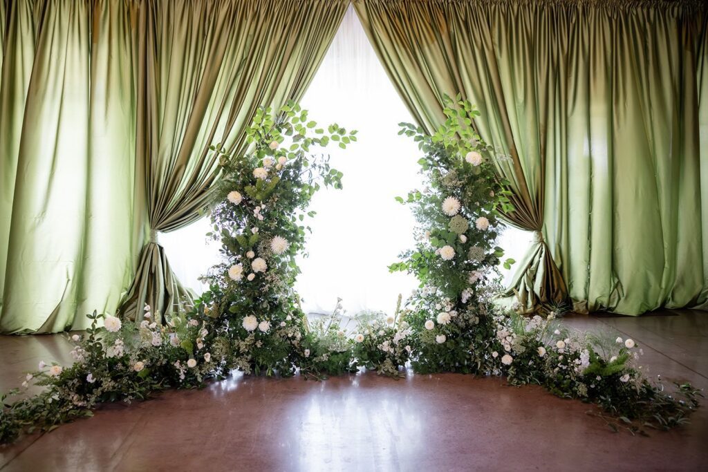 Ceremony arch green and pops of white