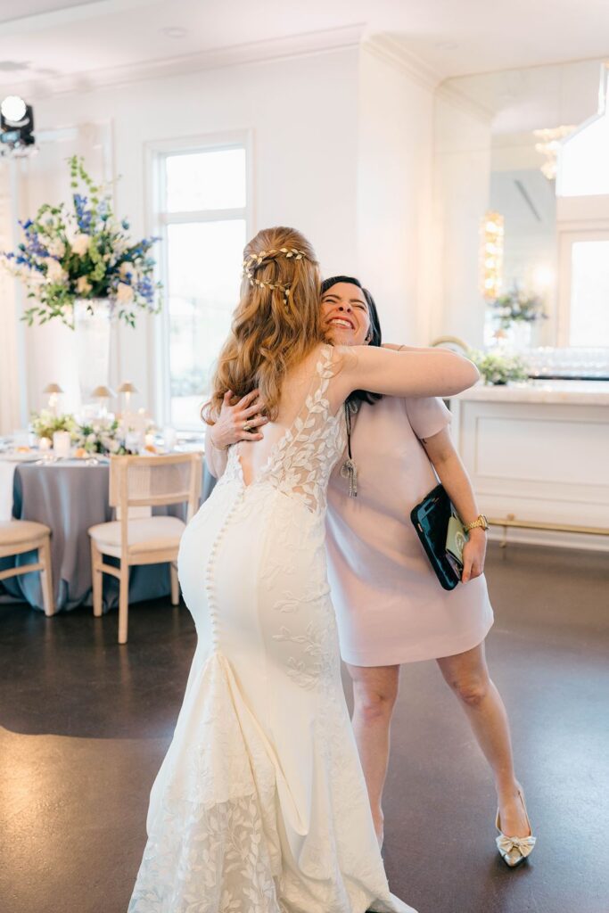 Bride hugs her wedding planner at Donovan Manor
