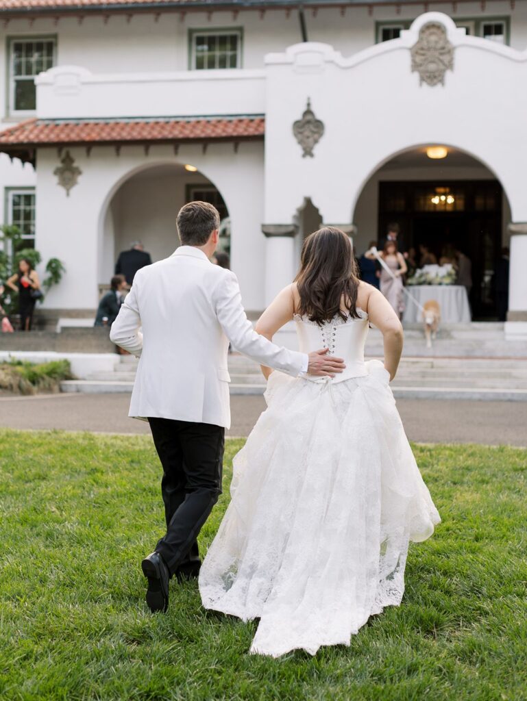 Bride and groom walking to the front of their venue