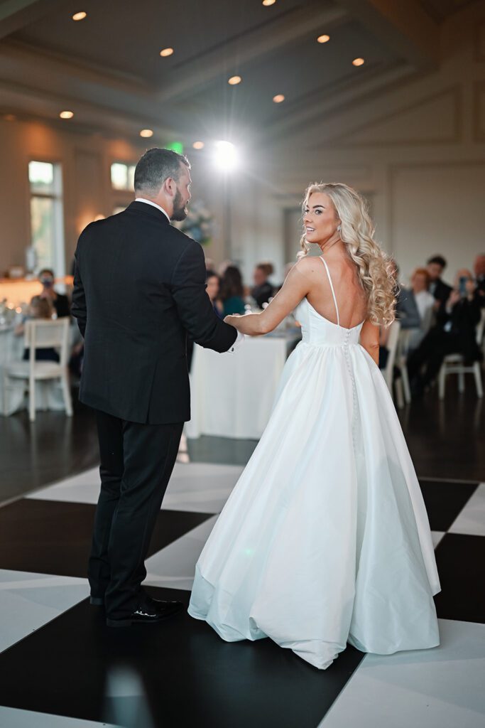 Bride and groom on black and white dance floor at Donovan Manor